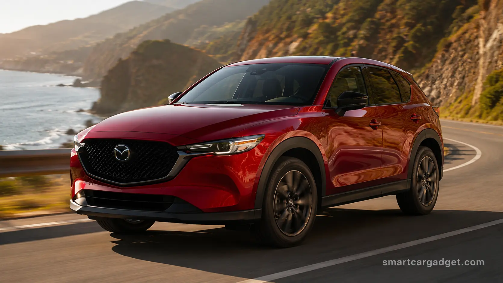 2026 Mazda CX-5 in red metallic paint driving on a winding coastal road